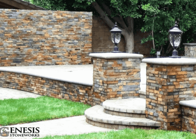 Genesis Stoneworks stone veneer pilasters, garden wall, fence wall and pavers installation